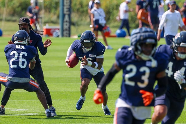 Bears safety Jonathan Owens (36) runs with the ball during an interception drill at a joint practice with the Dolphins at Halas Hall on Aug. 8, 2025, in Lake Forest. (Stacey Wescott/Chicago Tribune)