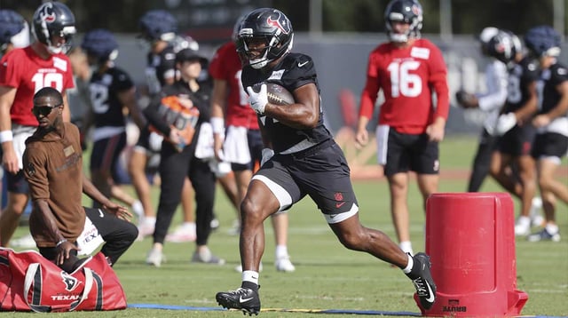Jul 24, 2025; Houston, TX, USA; Houston Texans running back Nick Chubb (21) during training camp at Houston Methodist Training Center. Mandatory Credit: Troy Taormina-Imagn Images