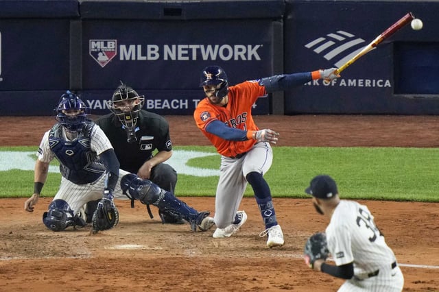 Carlos Correa connects for the go-ahead RBI single in the 10th inning of the Astros&#39; 5-3 win Friday at Yankee Stadium.