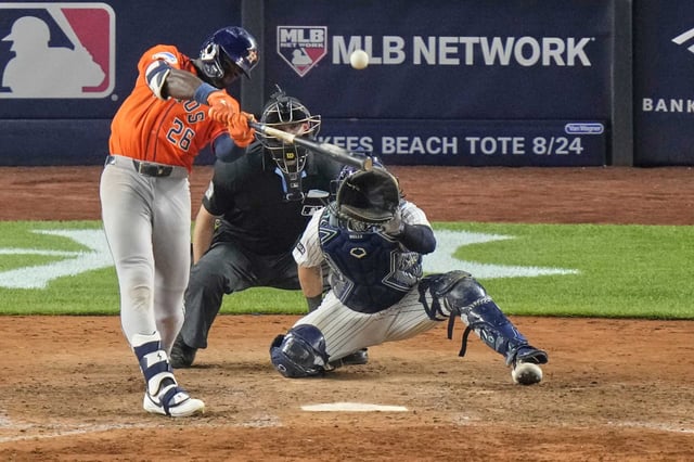 Houston Astros&#39; Taylor Trammell hits a two-run home run during the 10th inning of a baseball game against the New York Yankees Friday, Aug. 8, 2025, in New York. (AP Photo/Frank Franklin II)