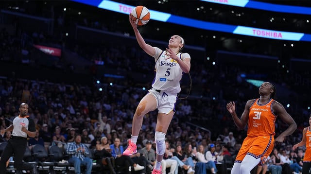 LA Sparks forward Dearica Hamby (5) goes up for a layup against the Connecticut Sun in the second half at Crypto.com Arena.