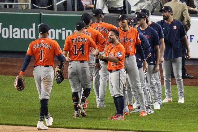 Houston Astros&#39; Jose Altuve (27) celebrates with teammates after a baseball game against the New York Yankees Friday, Aug. 8, 2025, in New York. (AP Photo/Frank Franklin II)