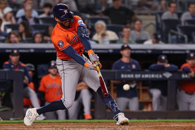 Aug 8, 2025; Bronx, New York, USA; Houston Astros shortstop Carlos Correa (1) hits an RBI single during the tenth inning against the New York Yankees at Yankee Stadium. Mandatory Credit: Vincent Carchietta-Imagn Images