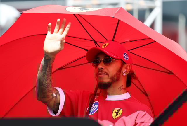Lewis Hamilton of Great Britain and Scuderia Ferrari waves on the drivers parade prior to the F1 Grand Prix of Hungary at Hungaroring on August 03, 2025 in Budapest, Hungary.