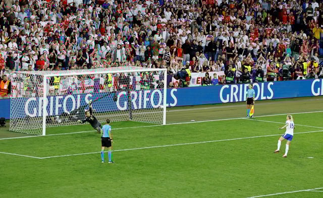 Soccer Football - UEFA Women's Euro 2025 - Final - England v Spain - St. Jakob-Park, Basel, Switzerland - July 27, 2025 England's Chloe Kelly scores the winning penalty past Spain's Catalina Coll in the penalty shootout REUTERS/Stefan Wermuth/File Photo
