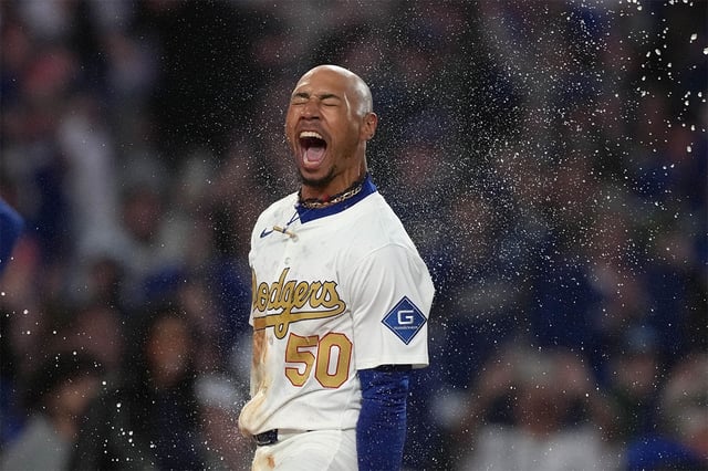 Mar 28, 2025; Los Angeles, California, USA; Los Angeles Dodgers shortstop Mookie Betts (50) celebrates after hitting a three-run walk-off home run in the 10th inning against the Detroit Tigers at Dodger Stadium. Mandatory Credit: Kirby Lee-Imagn Images