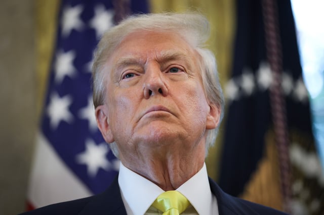 President Donald Trump listening to questions from reporters after speaking on economic data in the Oval Office on August 07, 2025 in Washington, DC.