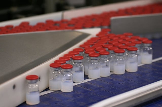 TOPSHOT - This picture taken in Monts, central France, on April 22, 2021, shows vials of the Moderna Covid-19 disease vaccine at Recipharm plant. Recipharm has been chosen by the American biotech Moderna to produce part of its candidate vaccine against Covid-19 in France. (Photo by GUILLAUME SOUVANT / AFP) (Photo by GUILLAUME SOUVANT/AFP via Getty Images)