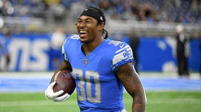 Dec 4, 2022; Detroit, Michigan, USA; Detroit Lions running back Jamaal Williams (30) laughs as he jokes with fans during pregame warm ups before their game against the Jacksonville Jaguars at Ford Field. Mandatory Credit: Lon Horwedel-Imagn Images