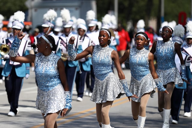 CHICAGO, USA – AUGUST 11:A team performs at the “Bud Billiken Parade” at Martin Luther King Drive in Chicago, United States on August 11, 2018. “Bud Billiken Parade” is an annual parade held since 1929 in the Bronzeville neighborhood of Chicago, the largest African-American parade in the nation. (Photo by Bilgin S. Sasmaz/Anadolu Agency/Getty Images)