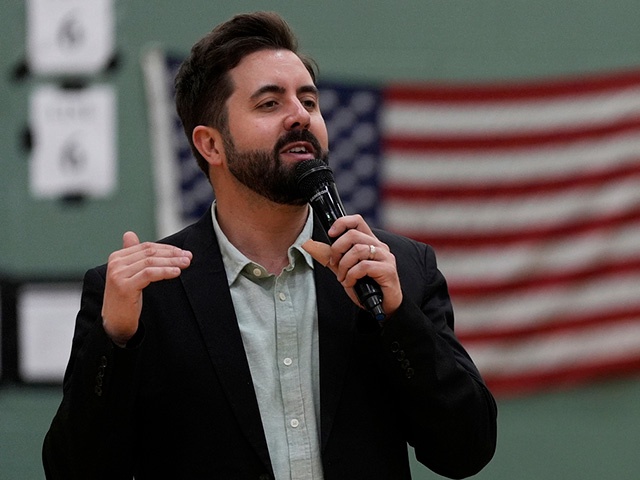 Title: Election 2025 Cincinnati Mayor
Image ID: 25111061032698
Article:  River Church Cincinnati pastor Cory Bowman, who is Vice President JD Vance's half brother and Cincinnati mayoral candidate, preaches during Easter worship service in the Hays Porter Elementary School gym Sunday, April 20, 2025, in Cincinnati. (AP Photo/Carolyn Kaster)
