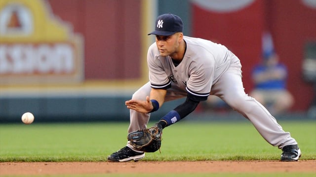 May 4, 2012; Kansas City, MO, USA; New York Yankees shortstop Derek Jeter (2) fields a round ball during second inning against the Kansas City Royals at Kauffman Stadium. Mandatory Credit: Peter G. Aiken-Imagn Images.