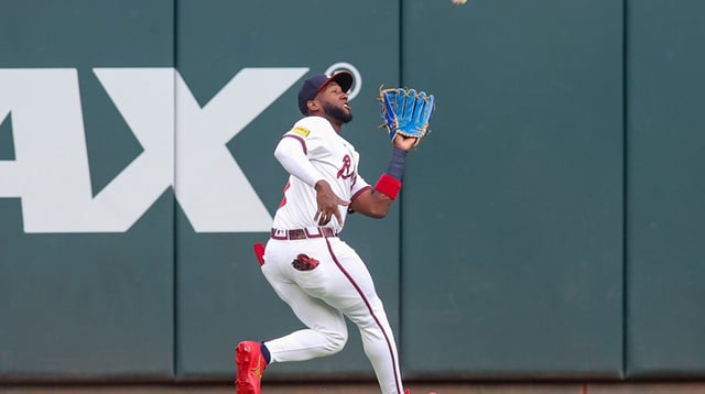Jul 21, 2025; Atlanta, Georgia, USA; Atlanta Braves left fielder Jurickson Profar (7) catches a fly ball against the San Francisco Giants in the first inning at Truist Park. Mandatory Credit: Brett Davis-Imagn Images.