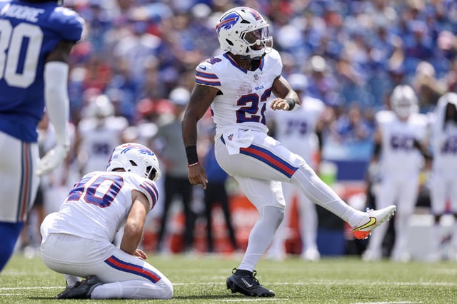 ORCHARD PARK, NEW YORK - AUGUST 09: Ray Davis #22 of the Buffalo Bills kicks a point after try during the second quarter of an NFL Preseason 2025 game between New York Giants and Buffalo Bills at Highmark Stadium on August 09, 2025 in Orchard Park, New York.