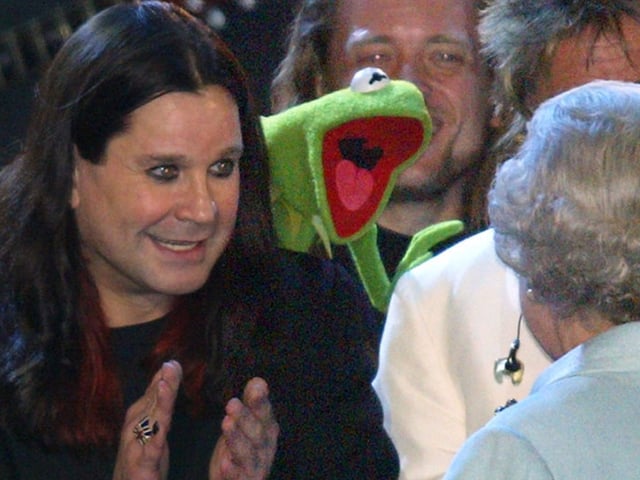 The Queen is introduced to Ozzy Osbourne and Kermit the Frog on stage during "Party at the Palace" in London 03 June 2002 as part of Queen Elizabeth's Golden Jubilee celebrations.