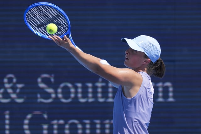 Aug 9, 2025; Cincinnati, OH, USA; Iga Swiatek (POL) serves against Anastasia Potapova (RUS) during the Cincinnati Open at the Lindner Family Tennis Center. Mandatory Credit: Aaron Doster-Imagn Images