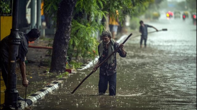A police officer said the boy likely missed the open manhole because of rainwater covering the road. (RAJ K RAJ /HT PHOTO)