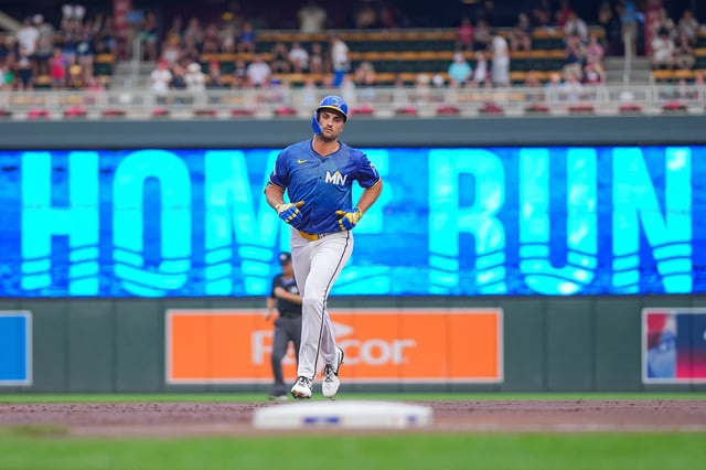 Aug 8, 2025; Minneapolis, Minnesota, USA; Minnesota Twins outfielder Matt Wallner (38) hits a home run against the Kansas City Royals in the first inning at Target Field. Mandatory Credit: Brad Rempel-Imagn Images