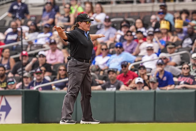 Aug 9, 2025; Cumberland, Georgia, USA; Umpire Jen Pawol (95) makes a safe call during the Atlanta Braves against the Miami Marlins game during the ninth inning at Truist Park. Mandatory Credit: Dale Zanine-Imagn Images