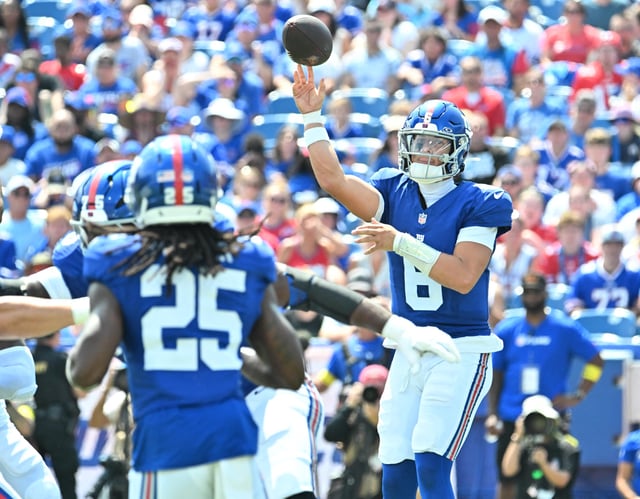 Aug 9, 2025; Orchard Park, New York, USA; New York Giants quarterback Jaxson Dart (6) throws a pass to running back Dante Miller (25) in the second quarter game against the Buffalo Bills at Highmark Stadium. Mandatory Credit: Mark Konezny-Imagn Images