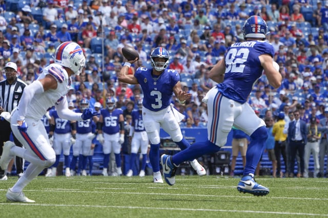 Aug 9, 2025; Orchard Park, New York, USA; New York Giants quarterback Russell Wilson (3) throws the ball to New York Giants tight end Daniel Bellinger (82) during the first half against the Buffalo Bills at Highmark Stadium. Mandatory Credit: Gregory Fisher-Imagn Images