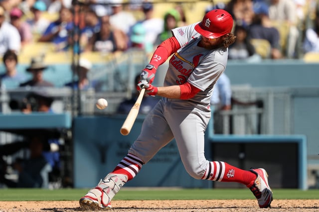 Aug 6, 2025; Los Angeles, California, USA;  St. Louis Cardinals second baseman Brendan Donovan (33) hits a single during the ninth inning against the Los Angeles Dodgers at Dodger Stadium. Mandatory Credit: Kiyoshi Mio-Imagn Images/File Photo