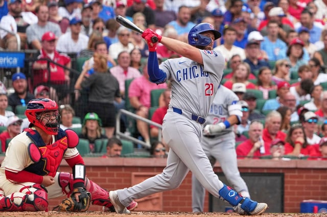 Cubs first baseman Michael Busch follows through on a three-run home run during the second inning against the Cardinals on Saturday, Aug. 9, 2025, in St. Louis. (Jeff Roberson/AP)