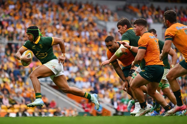 BRISBANE, AUSTRALIA - AUGUST 10: Kurt-Lee Arendse of the Springboks runs with the ball during The Rugby Championship match between Australia Wallabies and South Africa Springboks at Suncorp Stadium on August 10, 2024 in Brisbane, Australia. (Photo by Morgan Hancock/Getty Images)