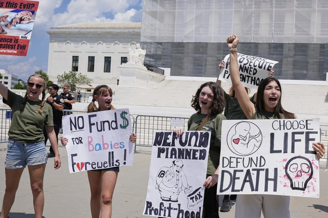 FILE - Anti-abortion protesters rally outside of the Supreme Court, June 26, 2025, in Washington. (AP Photo/Mariam Zuhaib, file)