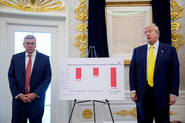 Stephen Moore, visiting fellow at the Heritage Foundation, left, and US President Donald Trump near a jobs chart in the Oval Office of the White House in Washigton, DC, US, on Thursday, Aug. 7, 2025.