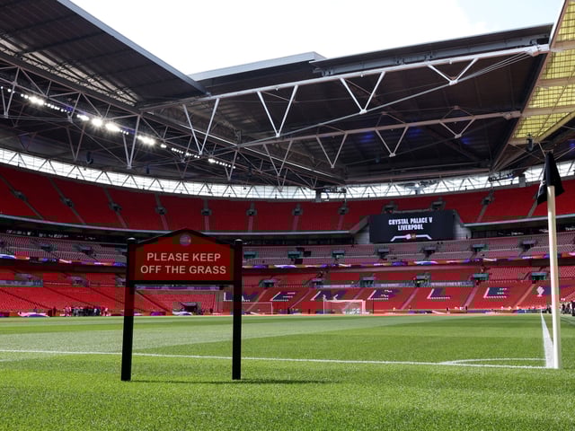 Soccer Football - FA Community Shield - Crystal Palace v Liverpool - Wembley Stadium, London, Britain - August 10, 2025
General view of a keep off the grass sign inside the stadium before the match REUTERS/Toby Melville