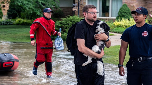 Wisconsin flooding: First responders rescue people from flooding in their homes on August 10, 2025 in Wauwatosa, Wisconsin. Heavy downpours brought as much as 13 inches of rain to parts of southeast Wisconsin overnight, resulting in widespread flooding across the region. 