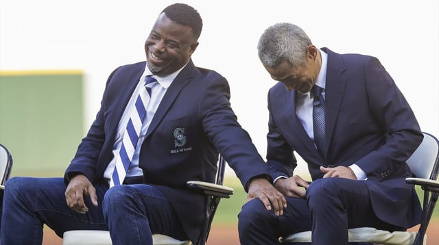Aug 9, 2025; Seattle, Washington, USA; Seattle Mariners former outfielder Ichiro Suzuki, right, reacts with outfielder Ken Griffey, Jr., left, during a ceremony to retire his number before a game against the Tampa Bay Rays at T-Mobile Park. Mandatory Credit: Joe Nicholson-Imagn Images