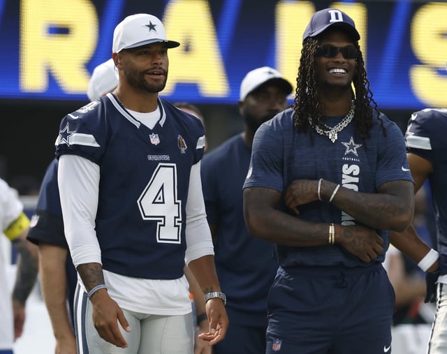 Dak Prescott #4 and CeeDee Lamb #88 of the Dallas Cowboys laugh on the sidelines during the second quarter in a NFL Preseason 2025 game between Dallas Cowboys and Los Angeles Rams at SoFi Stadium on August 09, 2025 in Inglewood, California.
