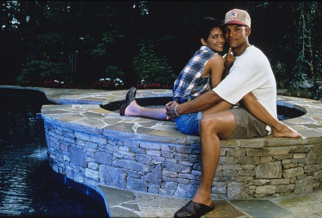 David Justice of the Atlanta Brave sand his wife, actress Halle Berry at their home in 1994 in Atlanta, Georgia.