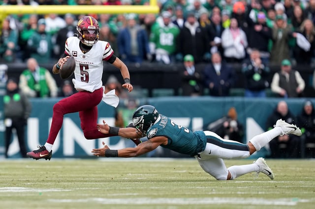 Jayden Daniels #5 of the Washington Commanders scrambles against Nolan Smith Jr. #3 of the Philadelphia Eagles prior to the NFC Championship Game at Lincoln Financial Field on January 26, 2025 in Philadelphia, Pennsylvania.