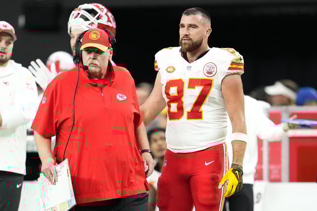 Head coach Andy Reid and Travis Kelce #87 of the Kansas City Chiefs look on during the second quarter of a game against the Las Vegas Raiders at Allegiant Stadium on November 26, 2023 in Las Vegas, Nevada.