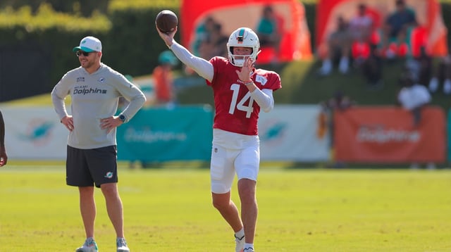 Jul 29, 2025; Miami Gardens, FL, USA; Miami Dolphins quarterback Quinn Ewers (14) throws the football during training camp at Baptist Health Training Complex. Mandatory Credit: Sam Navarro-Imagn Images