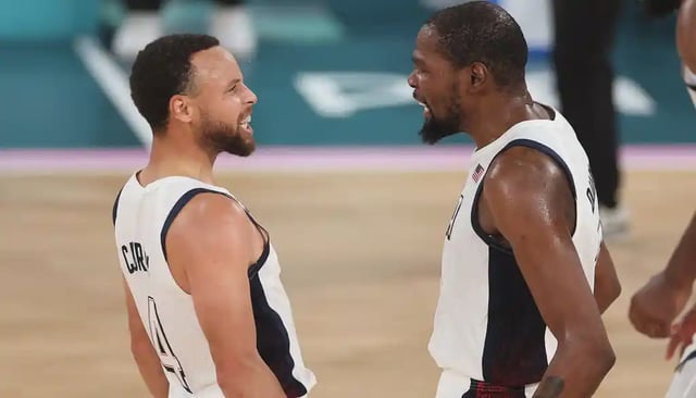 PARIS, FRANCE - AUGUST 08: Stephen Curry #4 and Kevin Durant #7 of Team United States celebrate after a basket during a Men&#39;s basketball semifinals match between Team United States and Team Serbia on day thirteen of the Olympic Games Paris 2024 at Bercy Arena on August 08, 2024 in Paris, France. (Photo by Sarah Stier/Getty Images)