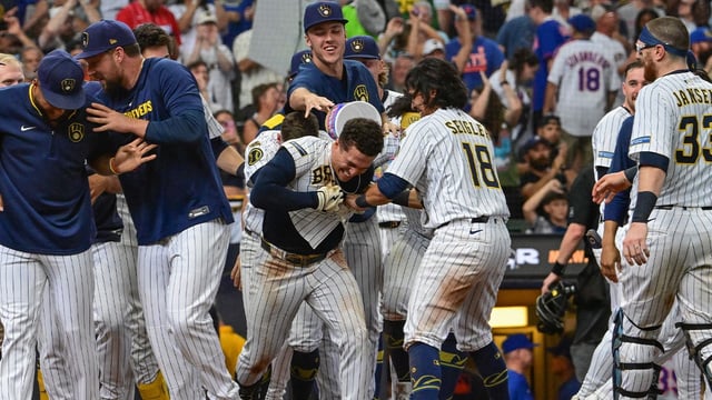 Aug 10, 2025; Milwaukee, Wisconsin, USA; Milwaukee Brewers left fielder Isaac Collins (6) celebrates with teammates after hitting a walk-off home run in the ninth inning against the New York Mets at American Family Field. Mandatory Credit: Benny Sieu-Imagn Images