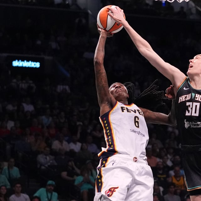 New York Liberty's Breanna Stewart (30) blocks a shot by Indiana Fever's Natasha Howard (6) during the second half of a WNBA basketball game Wednesday, July 16, 2025, in New York. (AP Photo/Frank Franklin II)