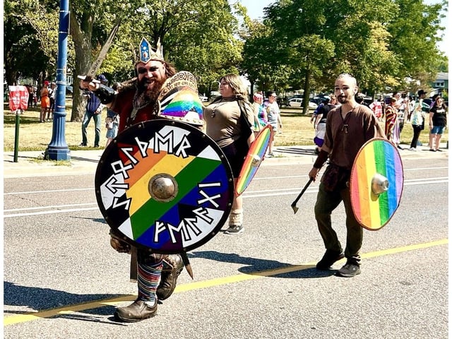  A member of the Rosstad (Rose City) Norsefolk re-enactment group puts on a show during the 33rd annual Pride Parade in Windsor Sunday, August 10, 2025.