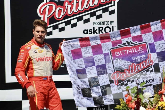 Will Power celebrates his win in the NTT IndyCar Series Grand Prix of Portland.