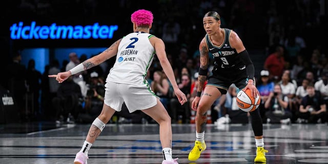 Aug 10, 2025; Brooklyn, New York, USA; New York Liberty guard Natasha Cloud (9) dribbles against Minnesota Lynx guard Natisha Hiedeman (2) during the first half at Barclays Center. Mandatory Credit: John Jones-Imagn Images