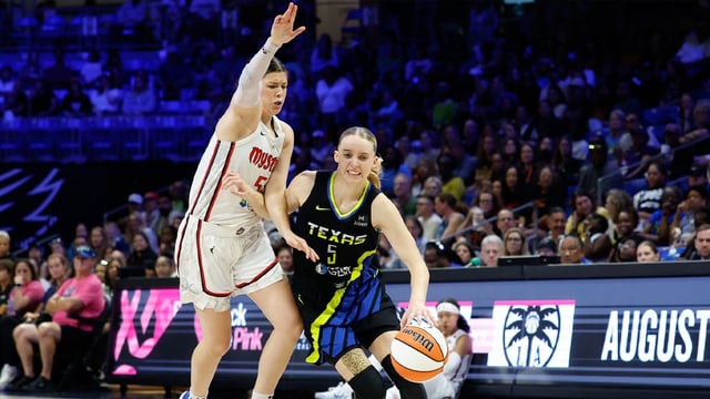 Aug 10, 2025; Arlington, Texas, USA; Dallas Wings guard Paige Bueckers (5) drives to the basket against Washington Mystics guard Jade Melbourne (5) during the second half at College Park Center. Mandatory Credit: Chris Jones-Imagn Images