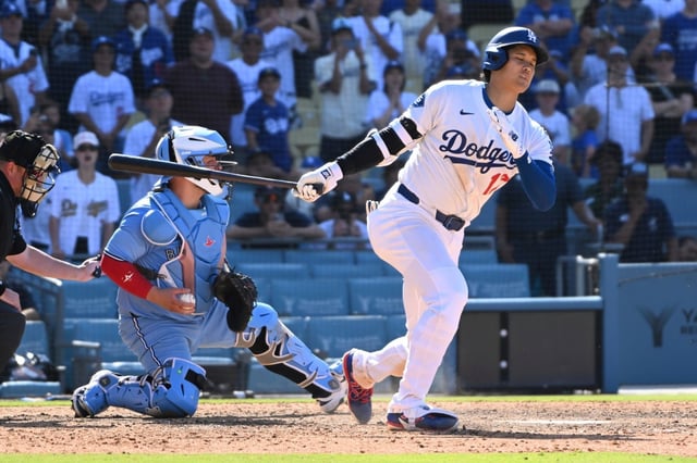 Dodgers’ Shohei Ohtani strikes out with the bases loaded during the ninth inning of a baseball game against the Toronto Blue Jays, Sunday, Aug. 10, 2025, in Los Angeles. (AP Photo/Wally Skalij)