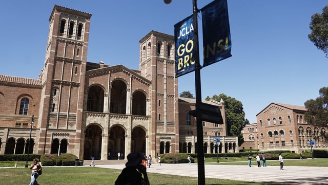 People walk on the plaza outside Royce Hall on the UCLA campus on July 30, 2025 in Los Angeles, California. 