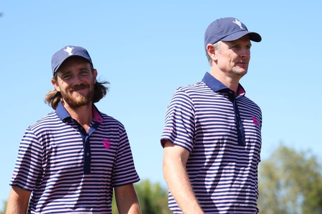 Tommy Fleetwood and Justin Rose of Team Great Britain &amp; Ireland walk off the 18th green after winning their match during the foursomes matches on day two of the Team Cup at Abu Dhabi Golf Resort on January 11, 2025 in Abu Dhabi, United Arab Emirates.