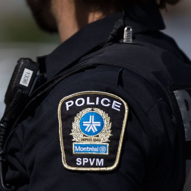 Correctional Service Canada says a convicted murderer who escaped from a Quebec prison nearly three weeks ago has been recaptured by Montreal police. An SPVM police shoulder patch is seen on an officer in Montreal, Aug. 29, 2024. THE CANADIAN PRESS/Christinne Muschi