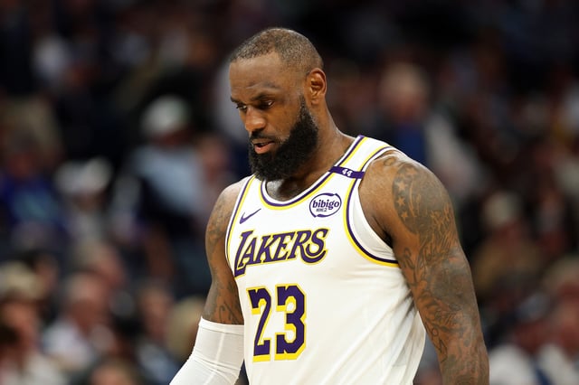 LeBron James #23 of the Los Angeles Lakers looks on against the Minnesota Timberwolves in the third quarter of Game Four of the First Round of the 2025 NBA Playoffs at Target Center on April 27, 2025 in Minneapolis, Minnesota.